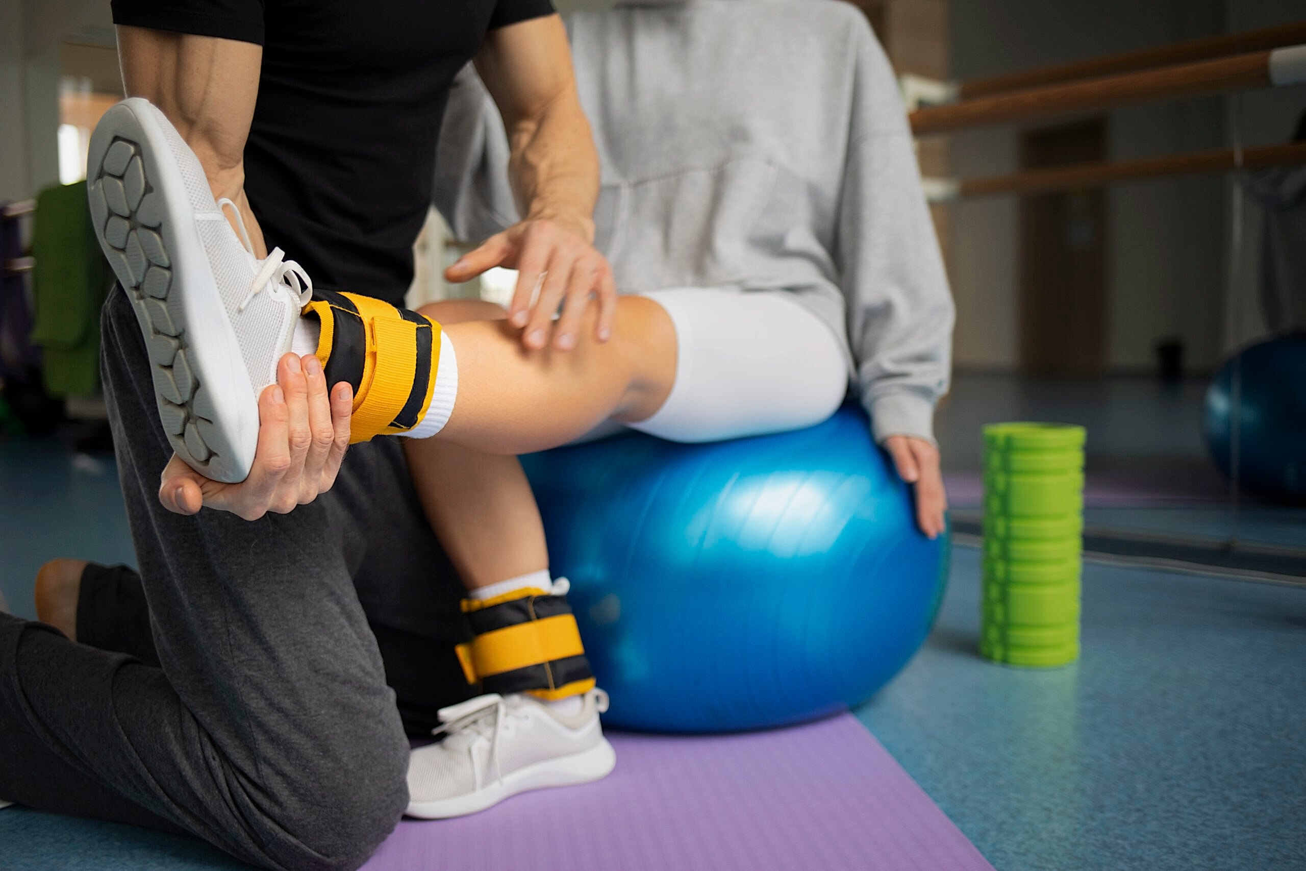 patient-doing-physical-rehabilitation-helped-by-therapists patient-doing-physical-rehabilitation-helped-by-therapists